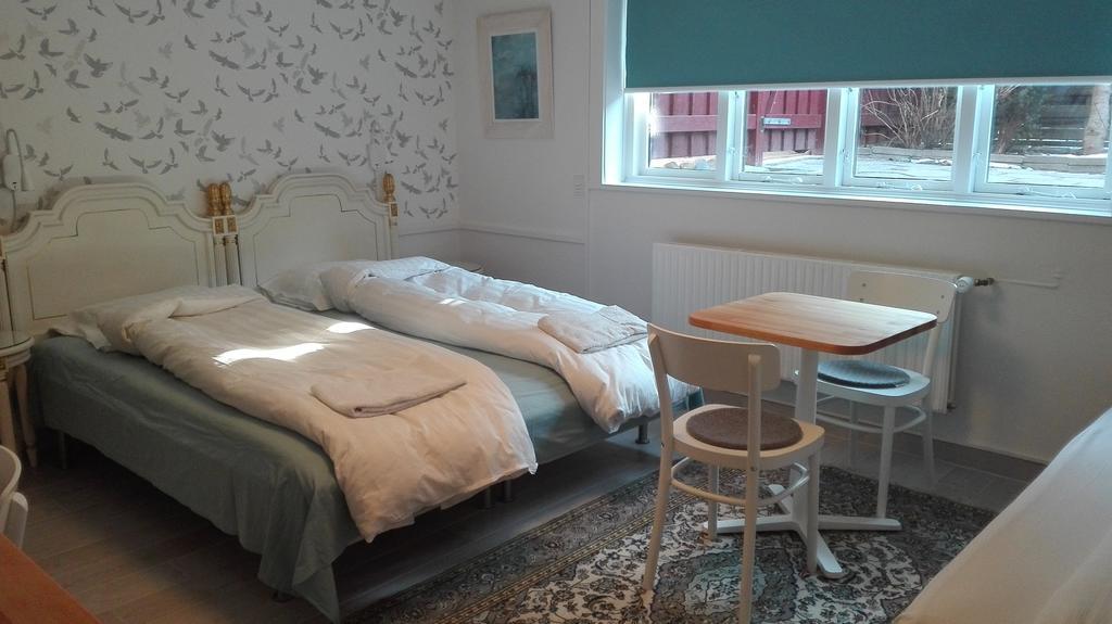 Quarto Triplo com Casa de Banho Partilhada